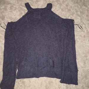 Knitted , cut off shoulder , long sleeve shirt